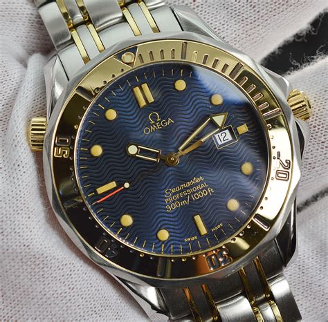 gold omega seamaster quartz watch.